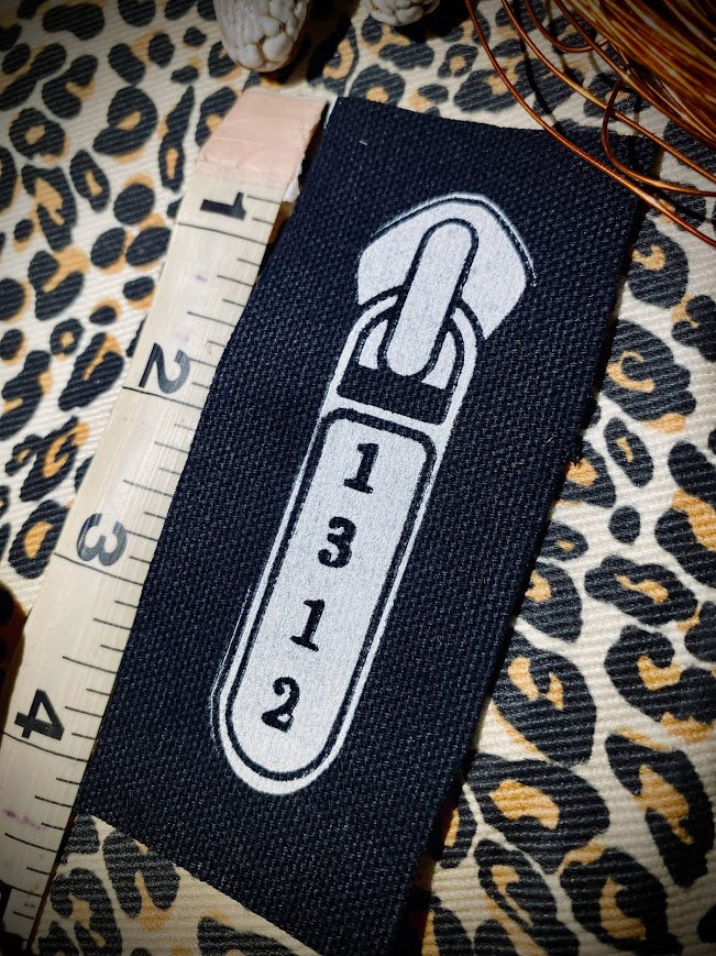 1312 ACAB zipper pull