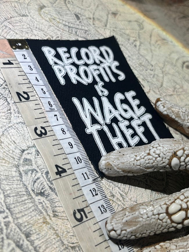 Record profits is wage theft. Sew on patch