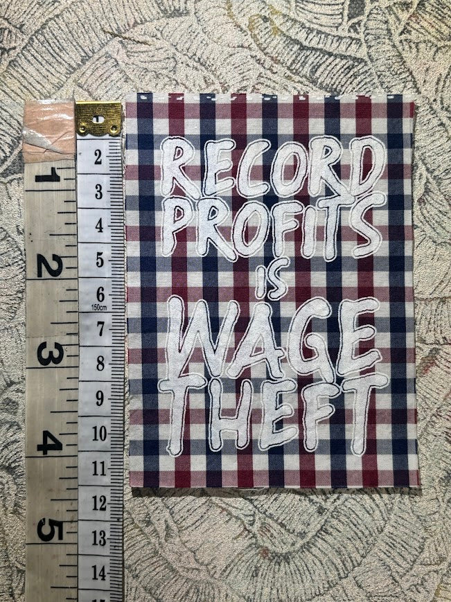 Record profits is wage theft. Sew on patch