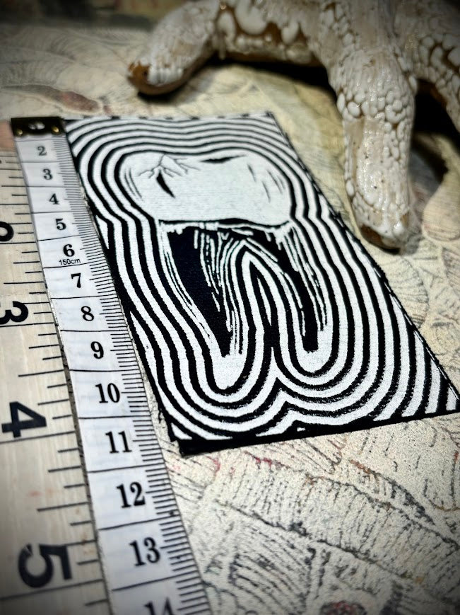 Tooth with a toothache patch.