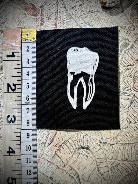 loose tooth patch. a mini patch with one toof