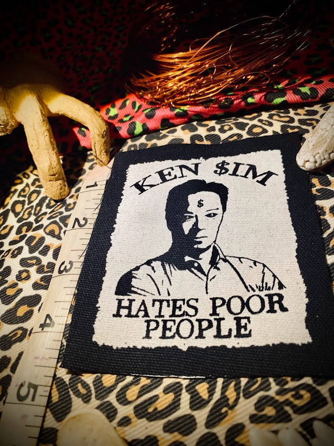 Ken Sim hates poor people sew on patch