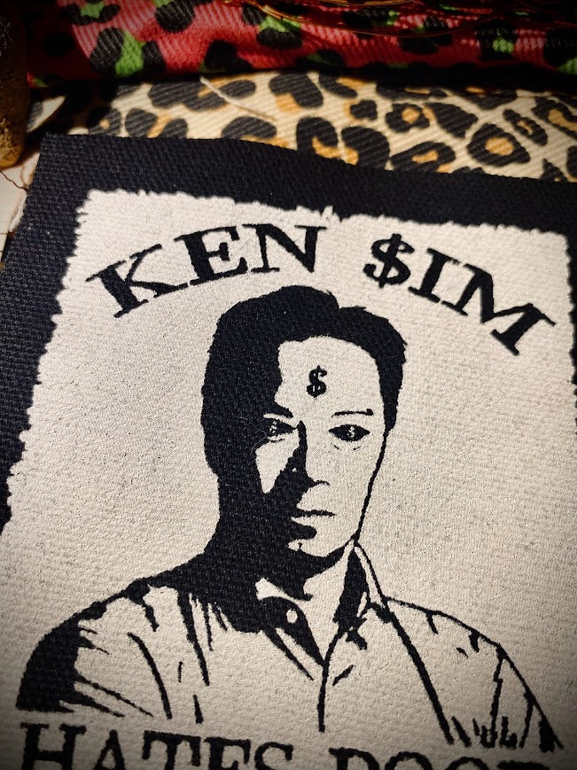 Ken Sim hates poor people sew on patch