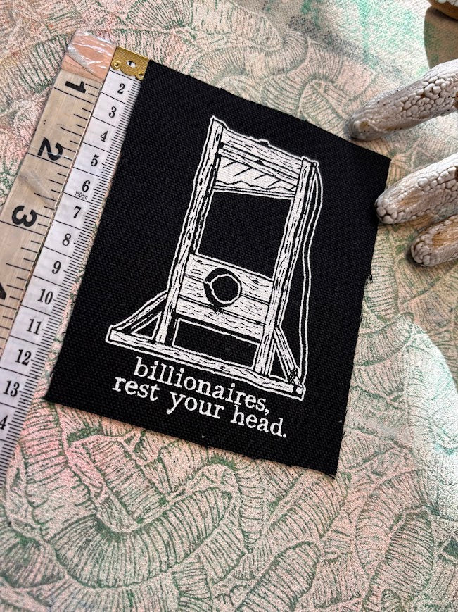 Guillotine sew on patch. Billionaires, rest your head