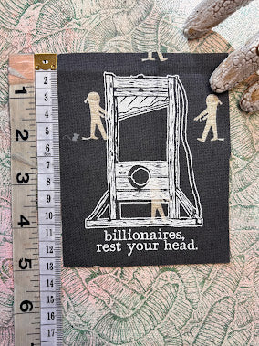 Guillotine sew on patch. Billionaires, rest your head