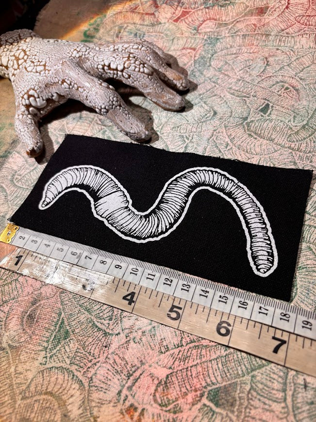 Worm sew on patch.
