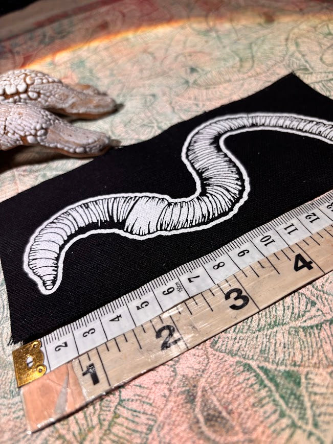 Worm sew on patch.