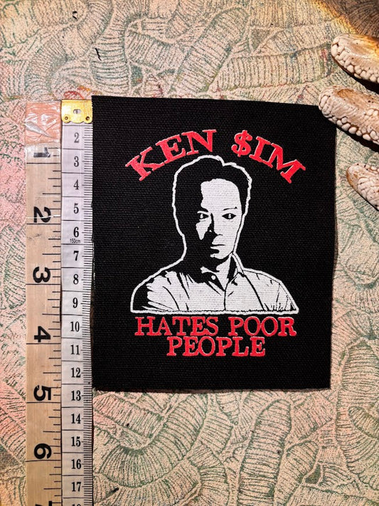 Ken Sim hates poor people sew on patch