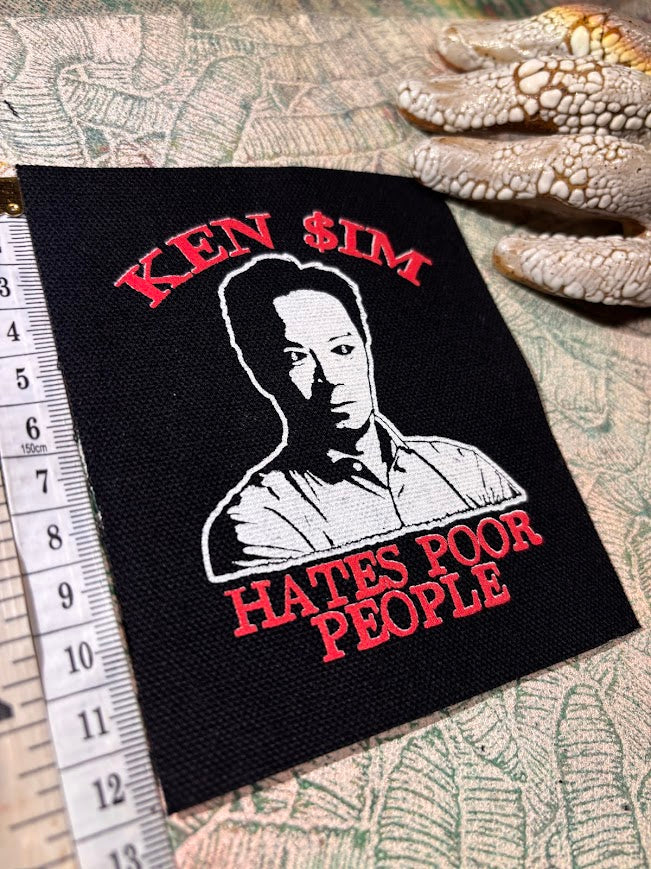Ken Sim hates poor people sew on patch