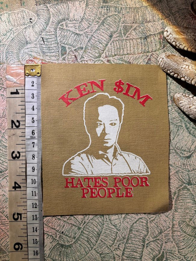 Ken Sim hates poor people sew on patch