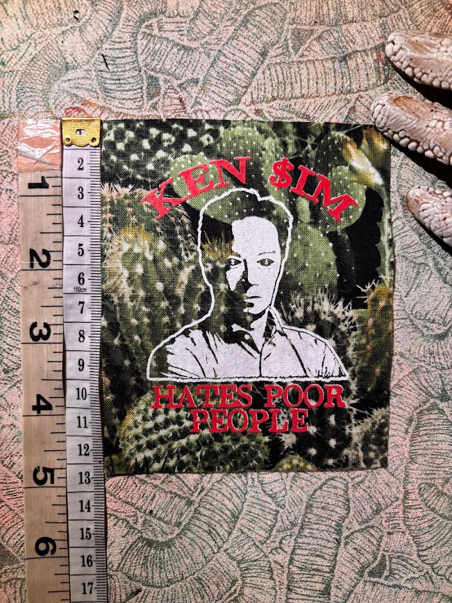 Ken Sim hates poor people sew on patch