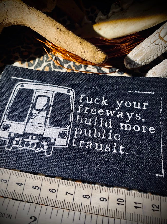 Fuck your freeways, build more public transit sew on patch.