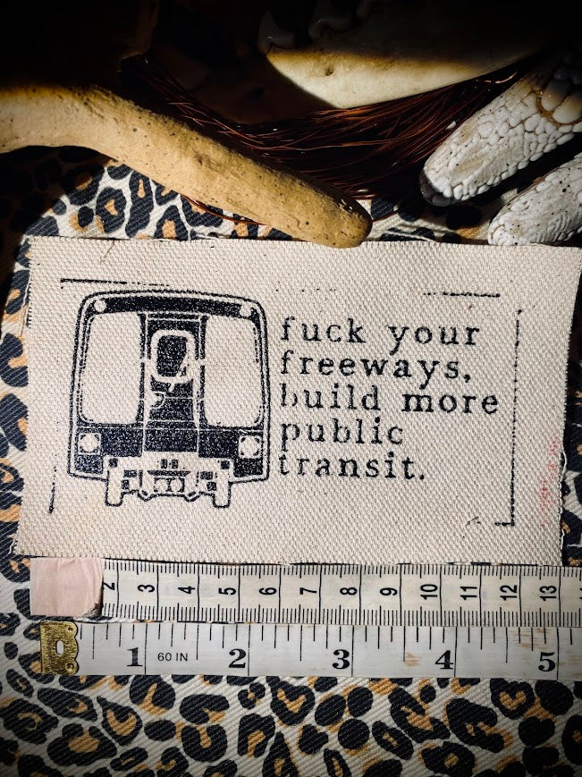 Fuck your freeways, build more public transit sew on patch.