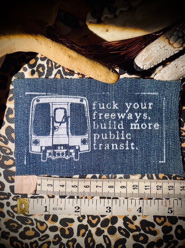 Fuck your freeways, build more public transit sew on patch.