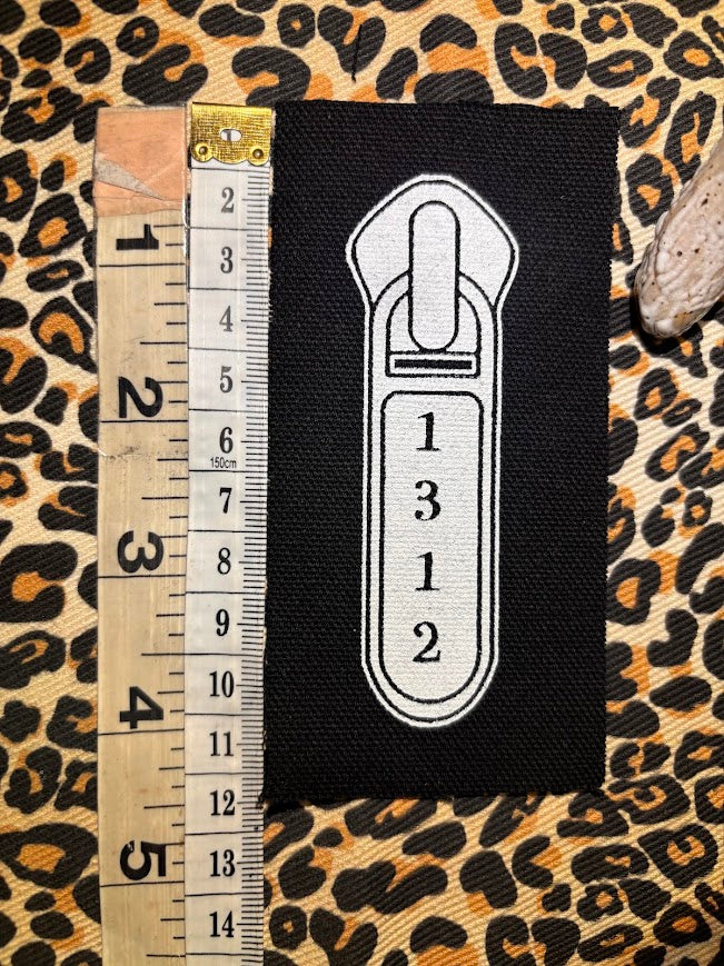 1312 ACAB zipper pull.