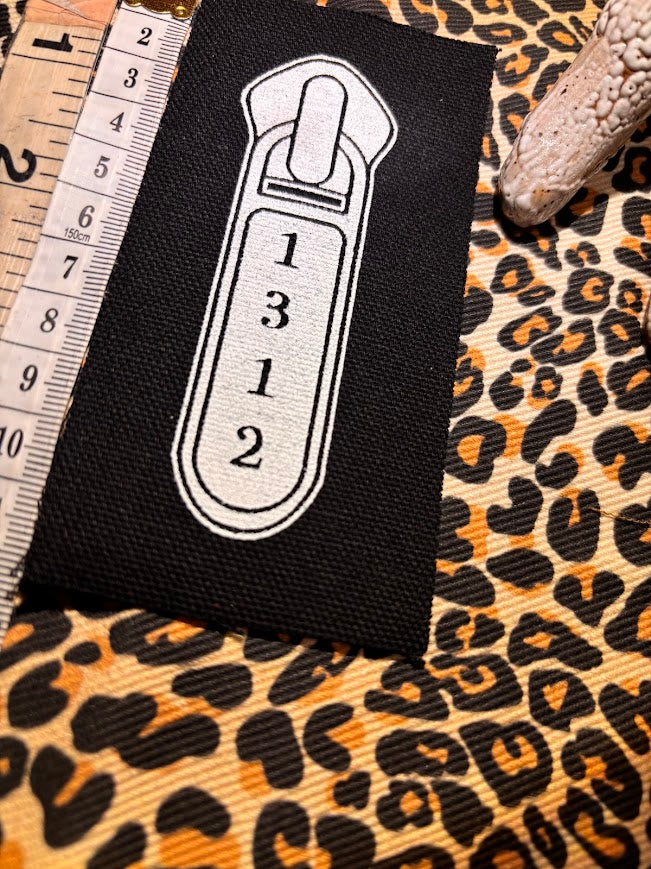1312 ACAB zipper pull