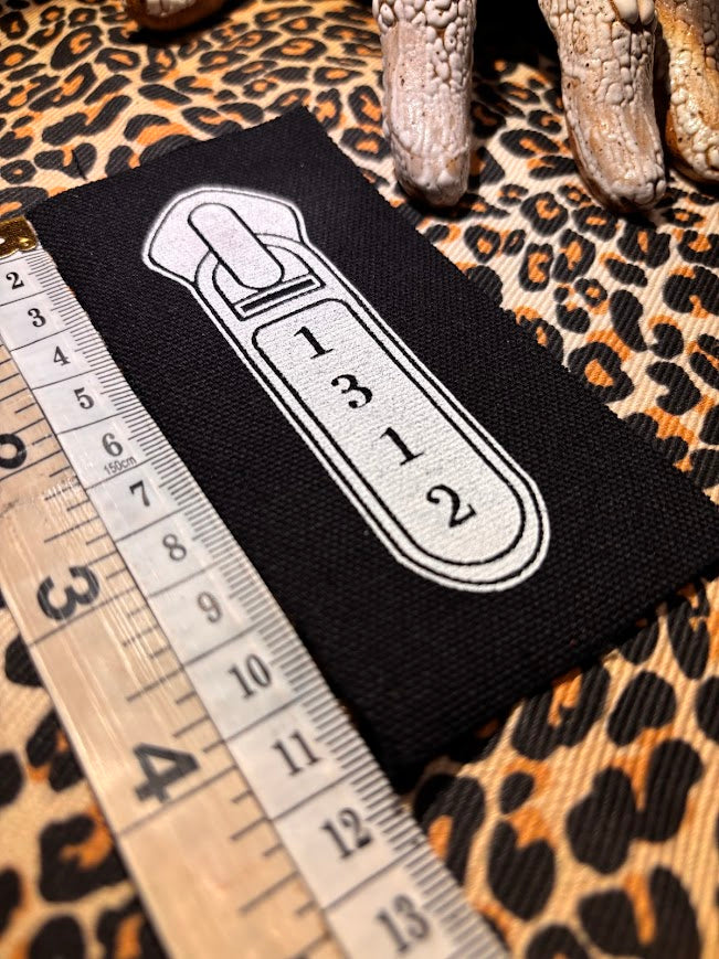 1312 ACAB zipper pull.
