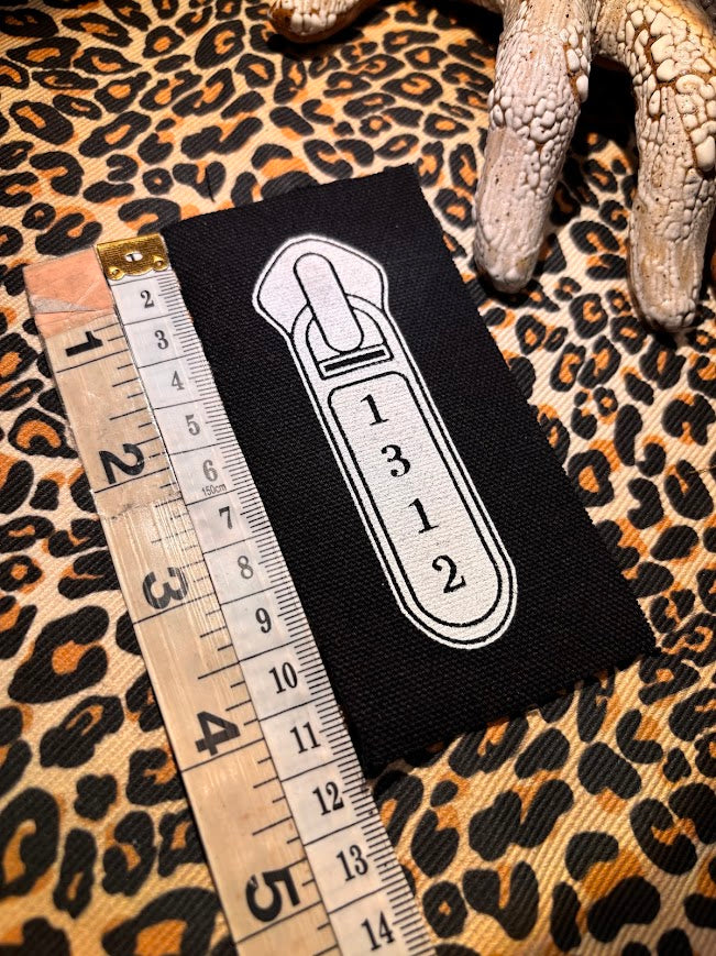 1312 ACAB zipper pull.