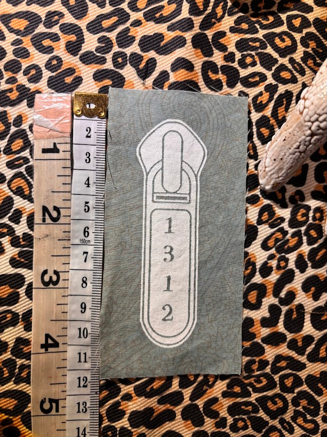 1312 ACAB zipper pull