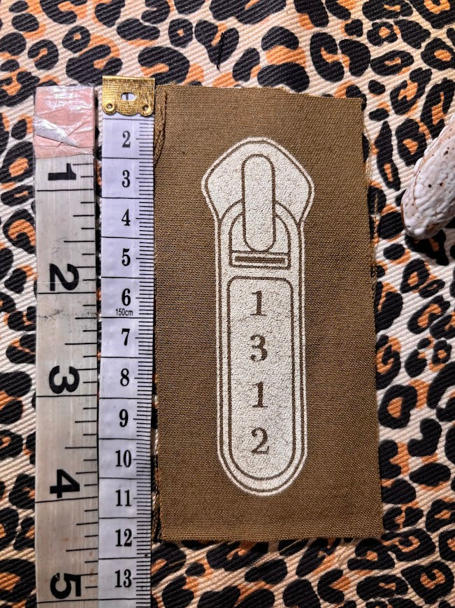 1312 ACAB zipper pull