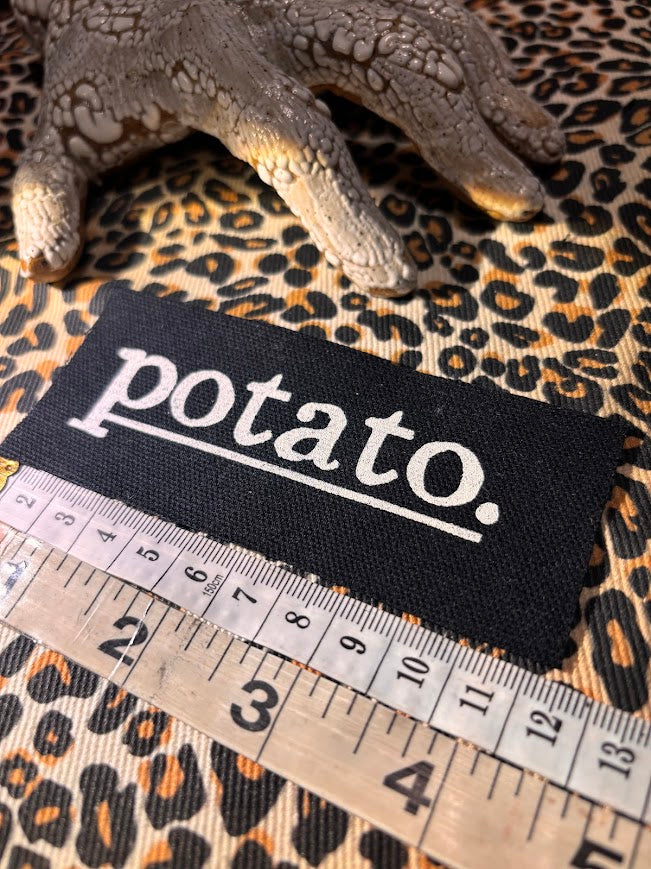 Potato patch. just a tiny patch that says potato