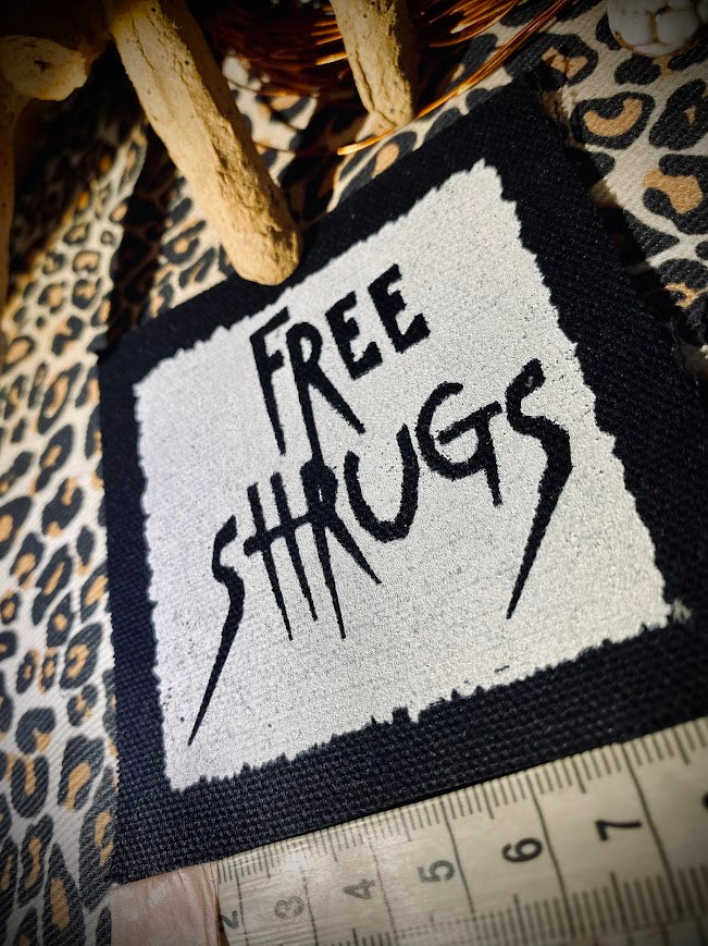 Free Shrugs sew on patch. never mind free hugs, you get free shrugs.