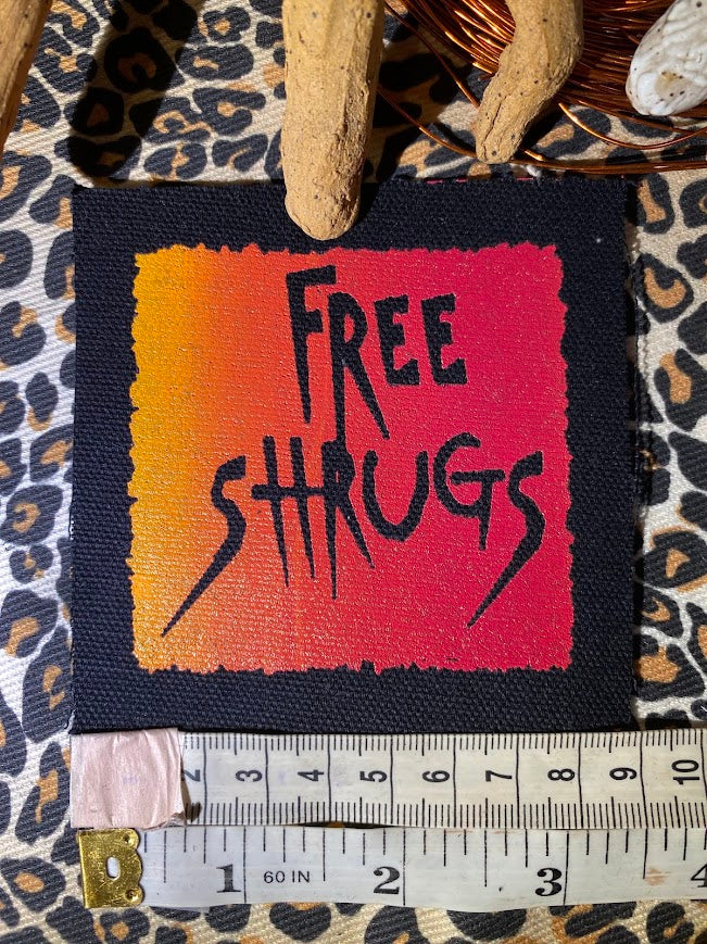 Free Shrugs sew on patch. never mind free hugs, you get free shrugs.