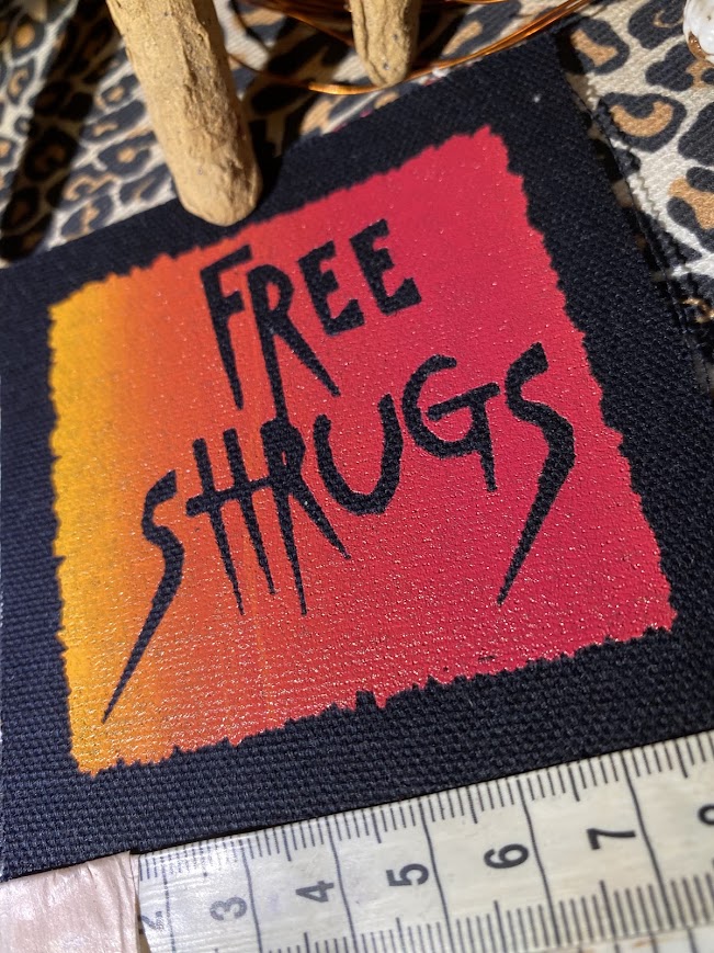 Free Shrugs sew on patch. never mind free hugs, you get free shrugs.