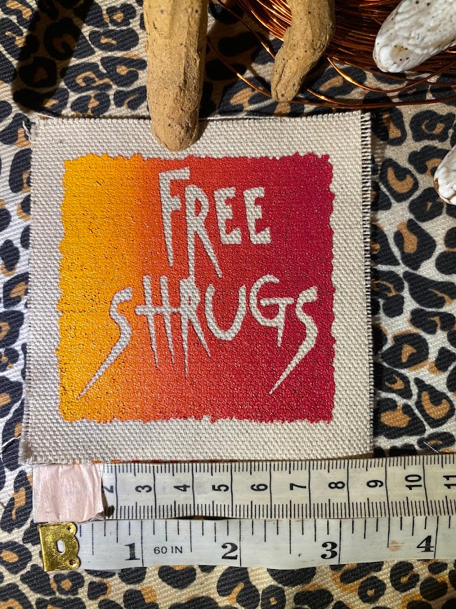 Free Shrugs sew on patch. never mind free hugs, you get free shrugs.