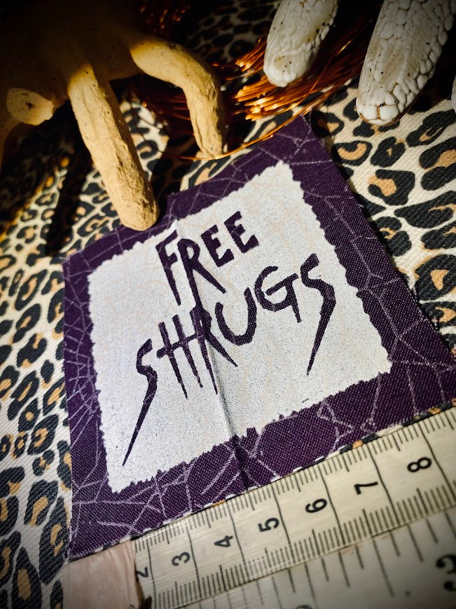 Free Shrugs sew on patch. never mind free hugs, you get free shrugs.