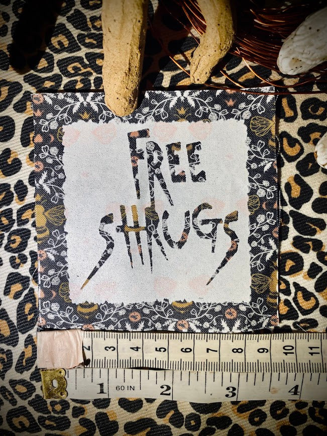 Free Shrugs sew on patch. never mind free hugs, you get free shrugs.