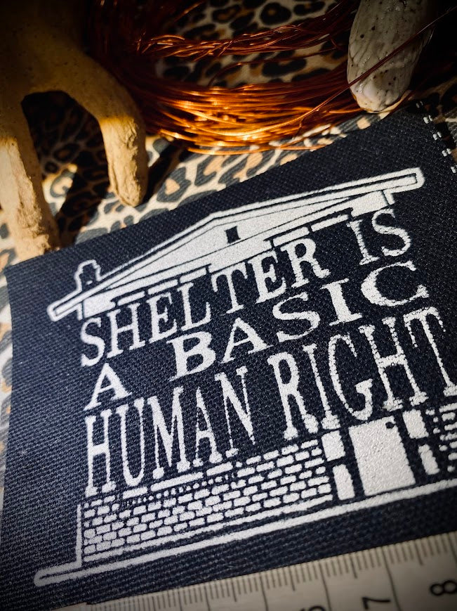 Shelter is a basic human right. sew on patch.