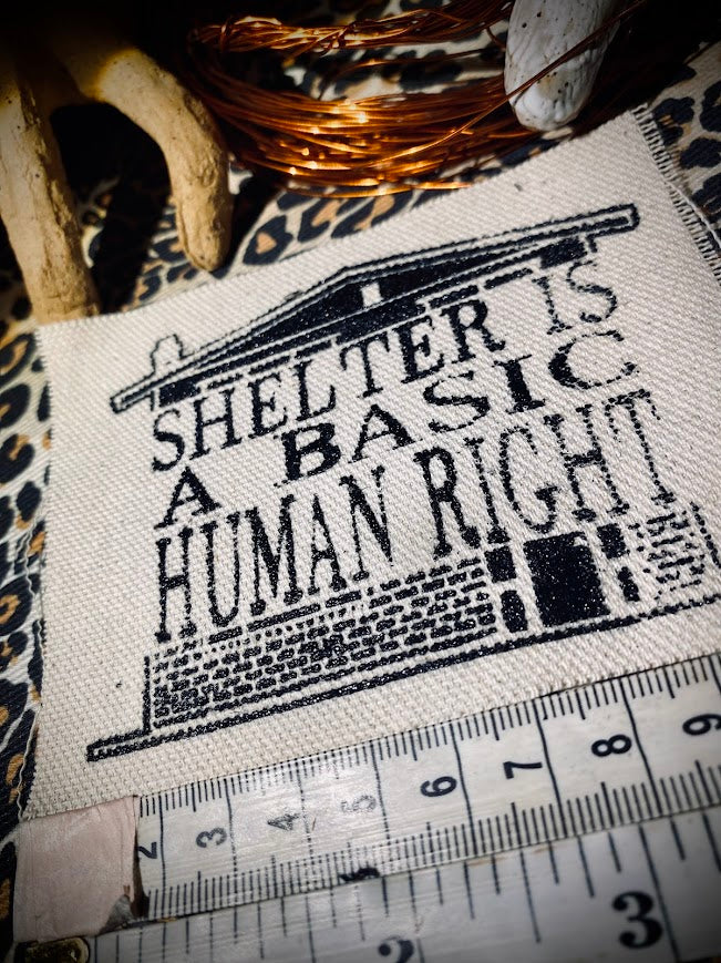 Shelter is a basic human right. sew on patch.