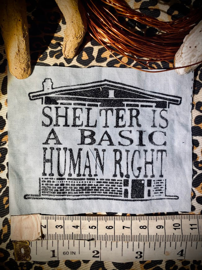 Shelter is a basic human right. sew on patch.