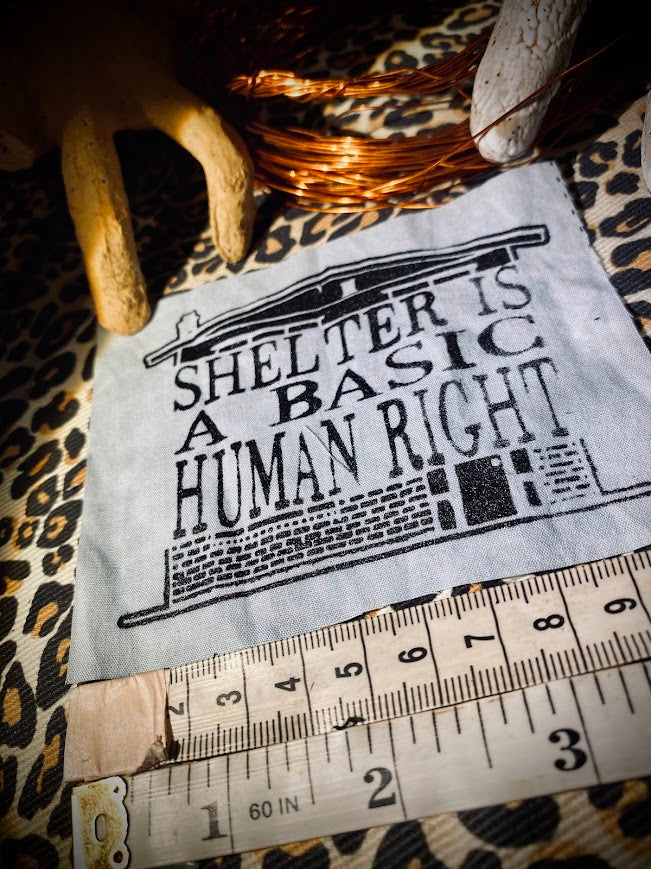 Shelter is a basic human right. sew on patch.