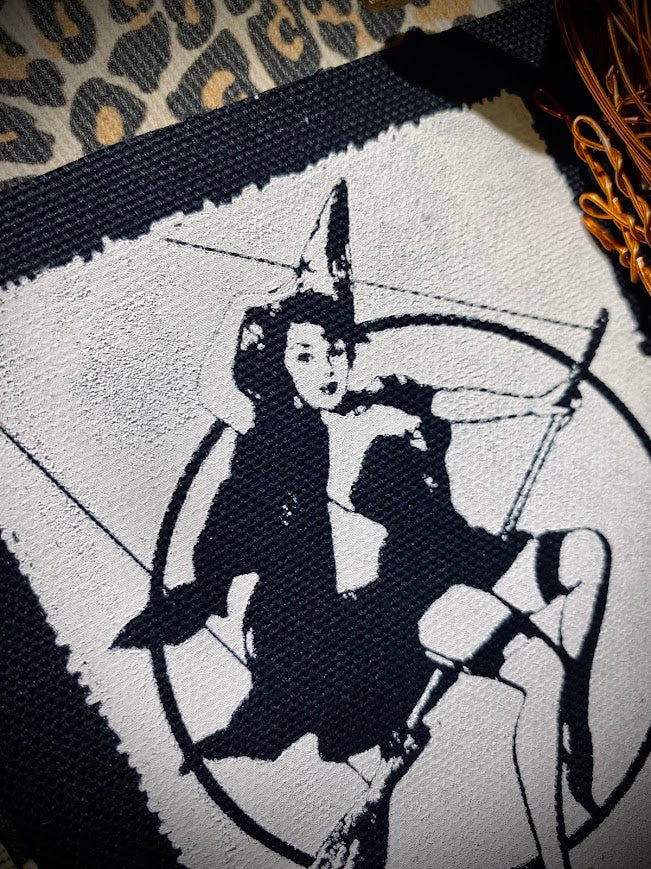 Witch pinup riding a broom sew on patch