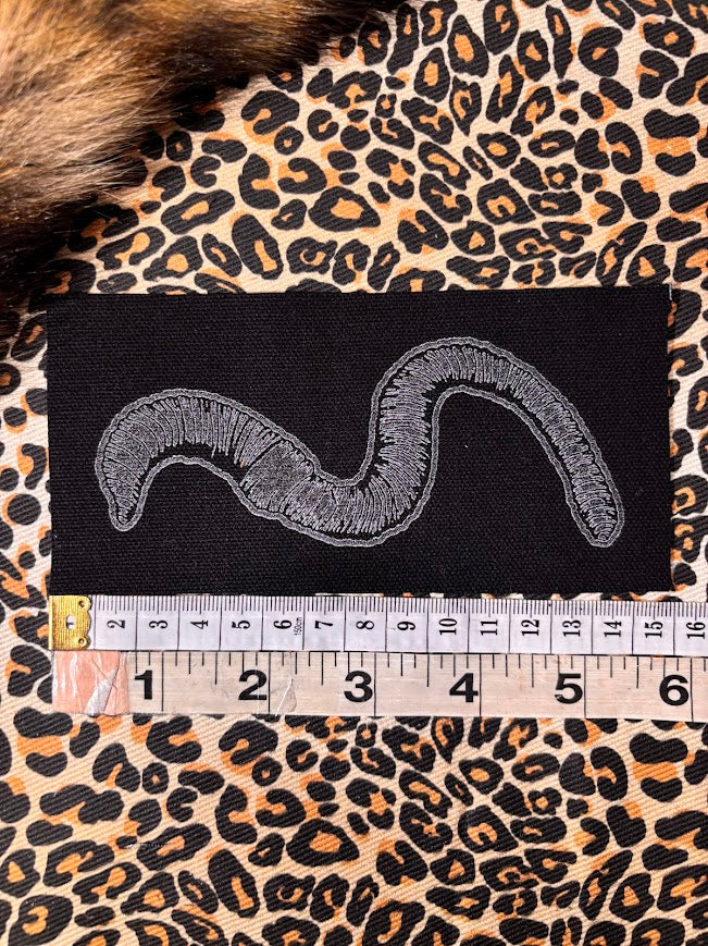 Worm sew on patch