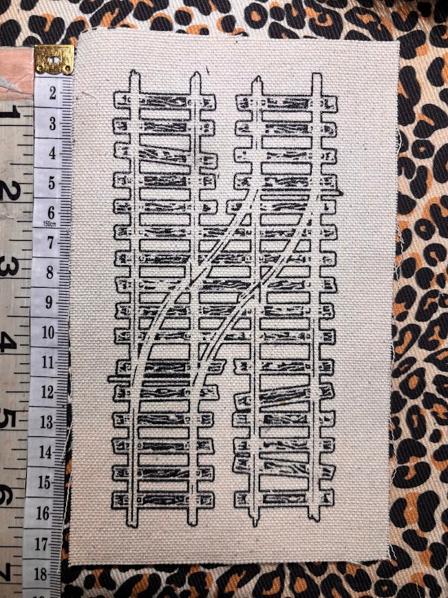 Two train tracks sew on patch
