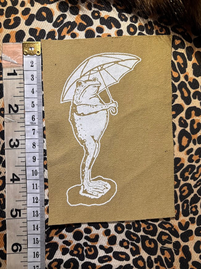 Sad frog holding an umbrella in the rain sew on patch
