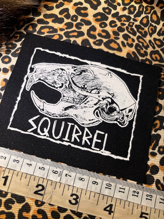 Squirrel skull patch.