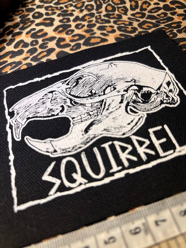 Squirrel skull patch.