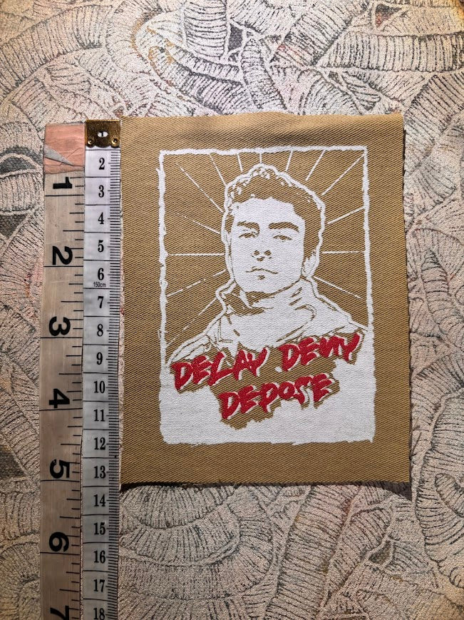 Luigi Mangione, Delay Deny Depose patch