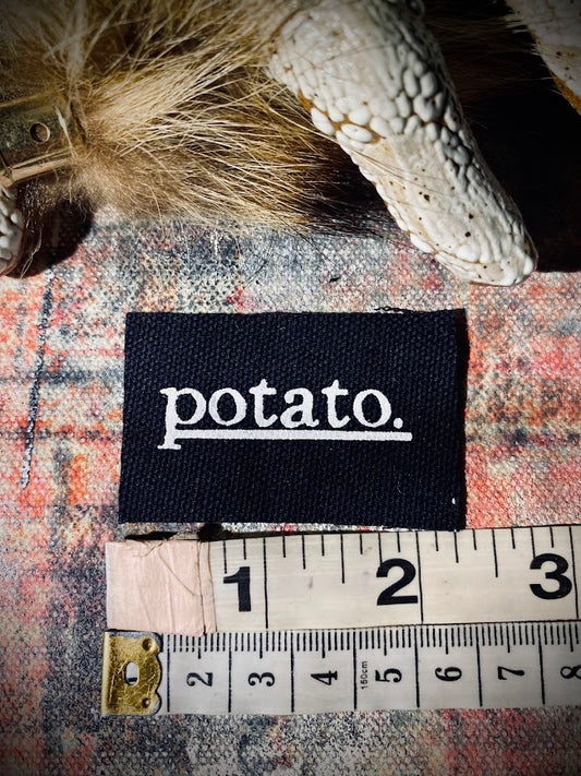 Potato patch. just a tiny patch that says potato.