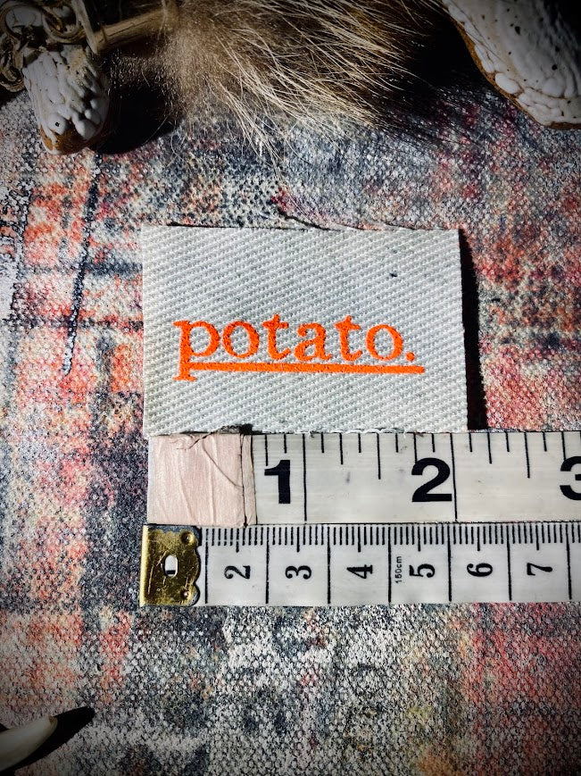 Potato patch. just a tiny patch that says potato.