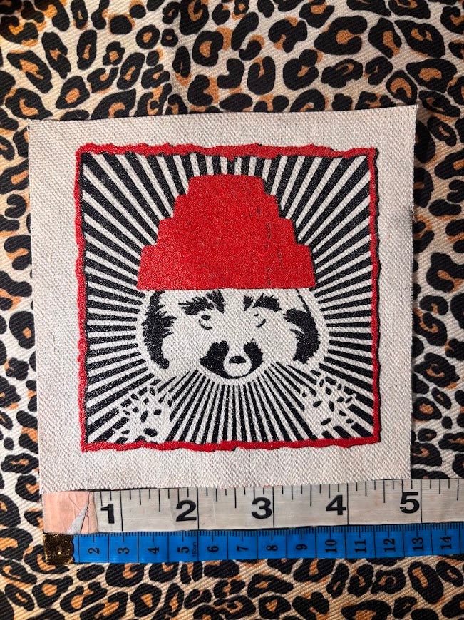 Are We not Trashy? Raccoon with a Devo hat patch