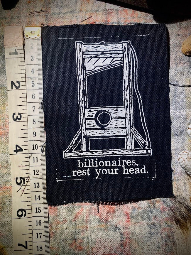 Guillotine sew on patch. Billionaires, rest your head