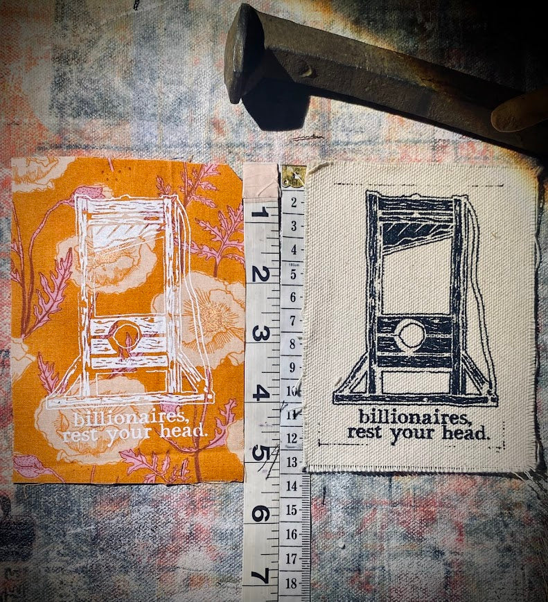 Guillotine sew on patch. Billionaires, rest your head