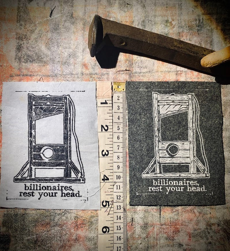 Guillotine sew on patch. Billionaires, rest your head