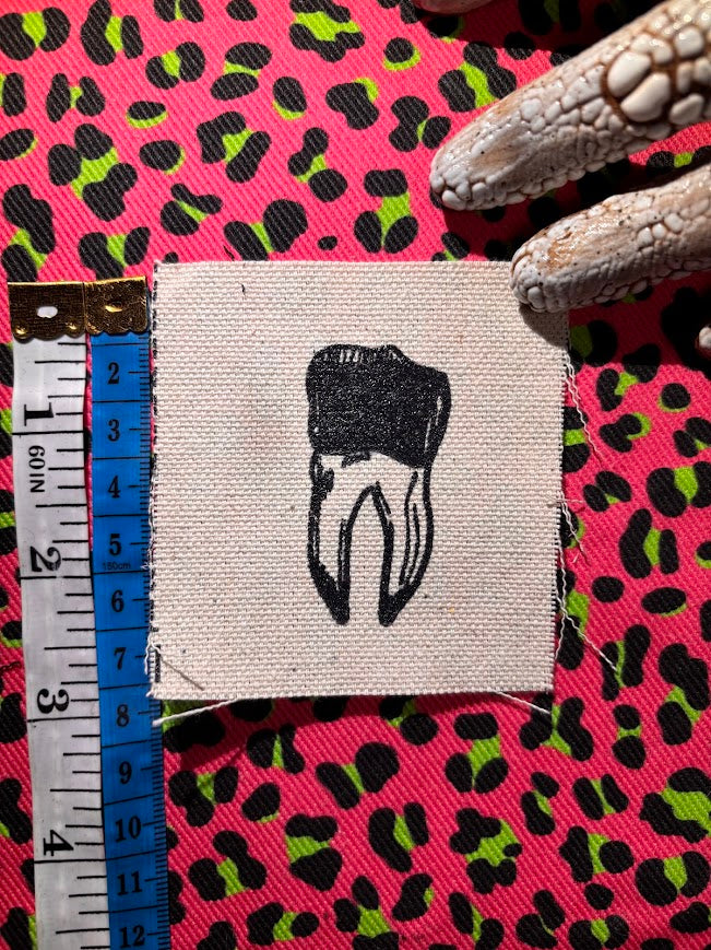 loose tooth patch. a mini patch with one toof