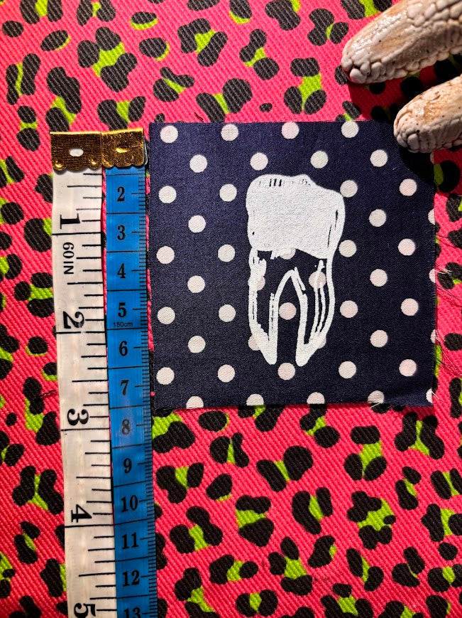 loose tooth patch. a mini patch with one toof